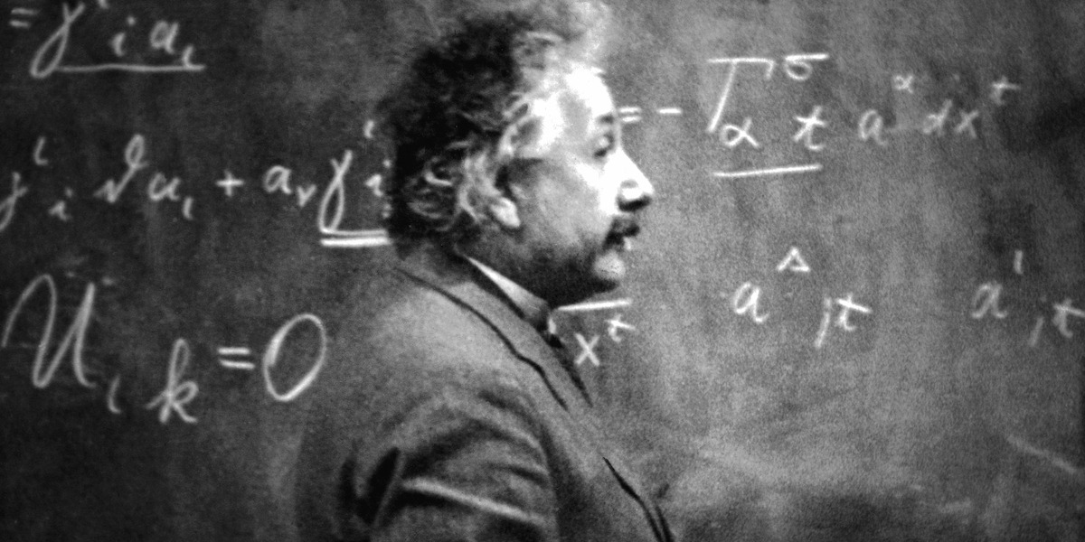 Albert Einstein standing in front of a chalkboard in ‘Einstein and the Bomb’.