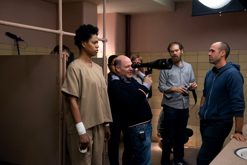 (L to R) Laverne Cox as Sophia, Matthew Weiner (Director), Ludovic Littee (Director of Photography) on the set of Orange Is The New Black Season 4.