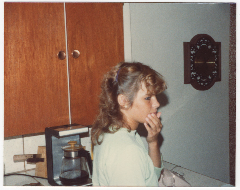 Pamela standing in the kitchen.
