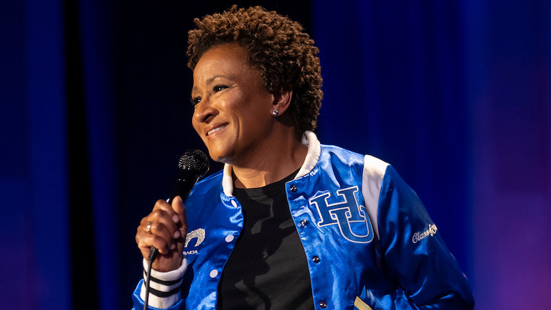 Wanda Sykes holds a microphone. 