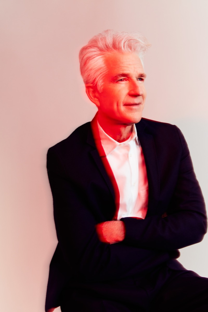 Matthew Modine seated - See Millie Bobby Brown and Matthew Modine’s ‘Stranger Things’ Cover Shoot Photos 
