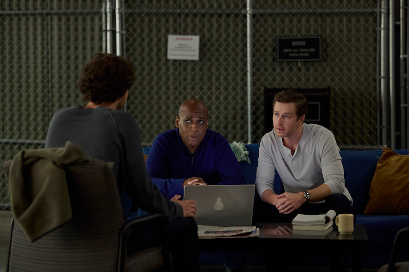 three people sitting down 