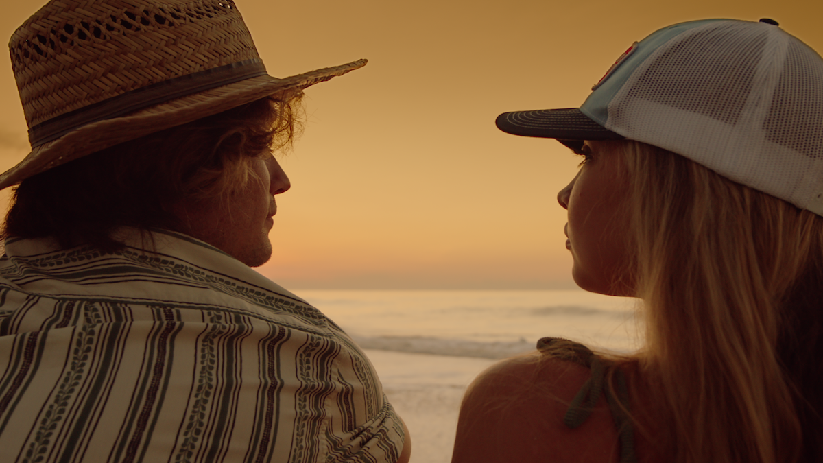 John (Chase Stokes) and Sarah (Madelyn Cline) share a moment on ‘Outer Banks.’