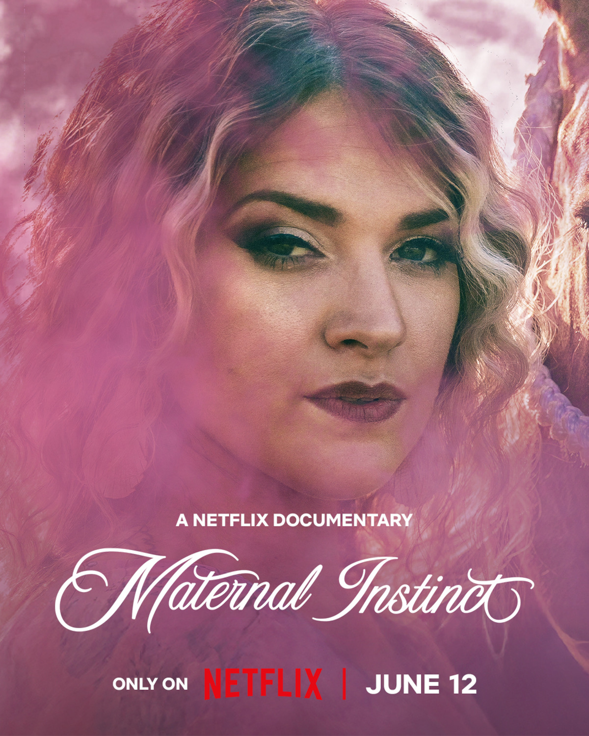 Woman with wavy blonde hair and serious expression, surrounded by a pink haze; text overlay reads "A Netflix Documentary Maternal Instinct, Only on Netflix, June 12."