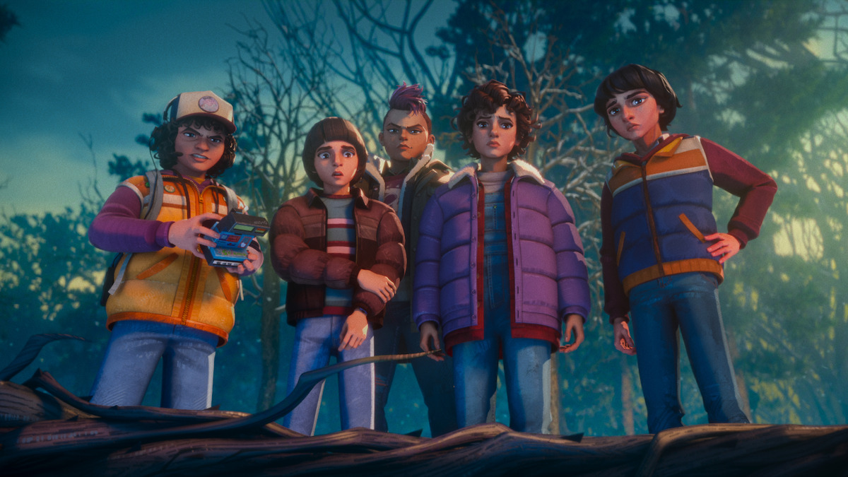 Five animated kids in jackets stand closely together outdoors in a forest, looking down with serious expressions, as one holds a walkie-talkie device. The scene is set at dusk with trees in the background.