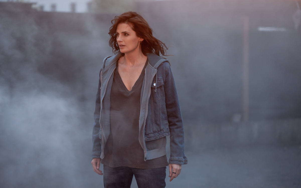 Stana Katic as Emily Bryne observes a crime scene in ‘Absentia.’