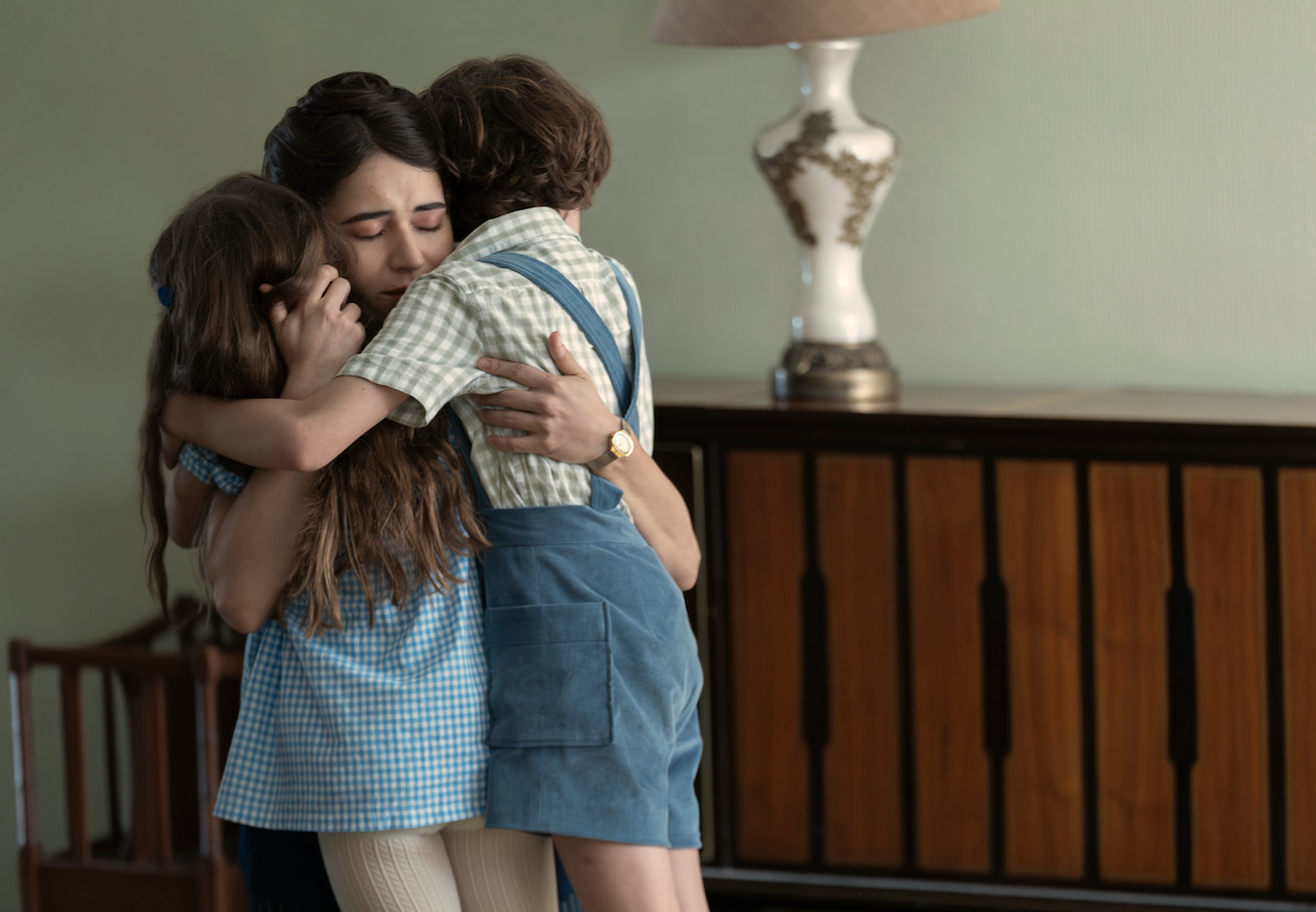 Marion Siro as Tamara, Tessa Ia as Valeria, Alexander Varela as Isaac reunite with a hug in ‘No One Saw Us Leave.’