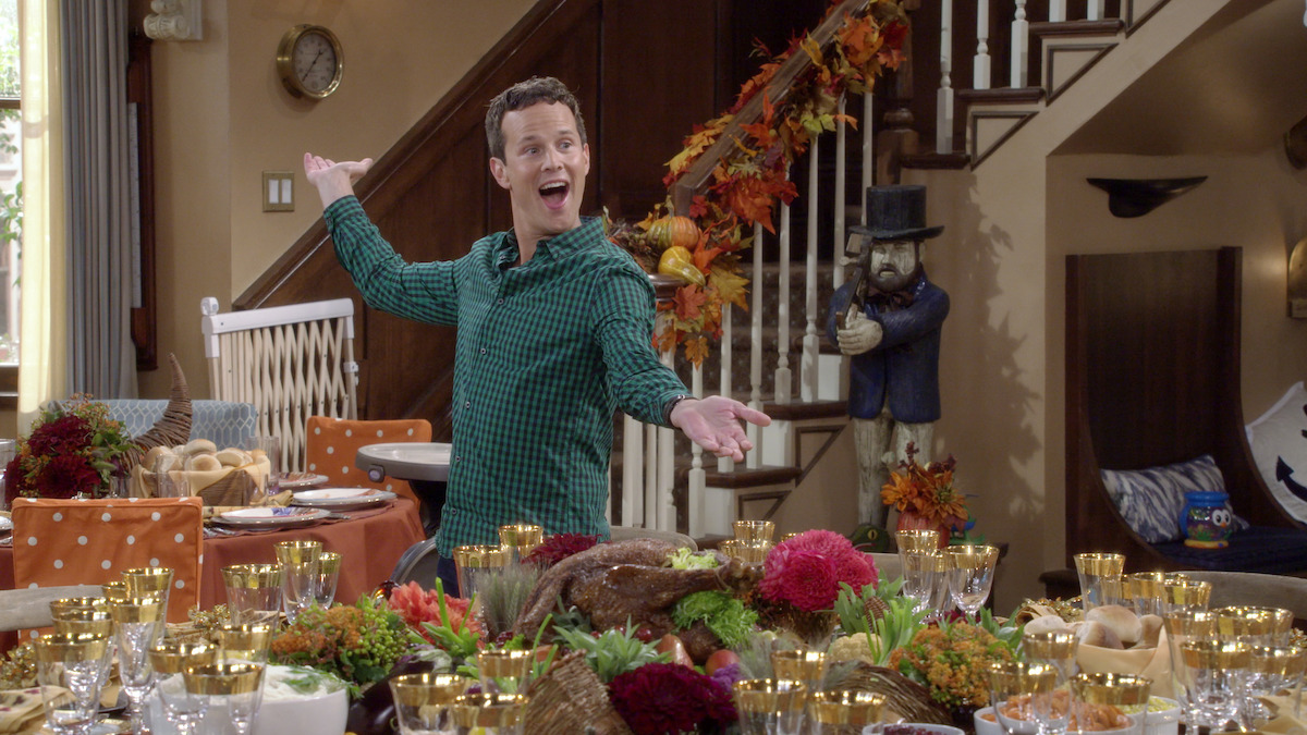 Fuller House - A man looks proud at the thankgiving table setting job he did