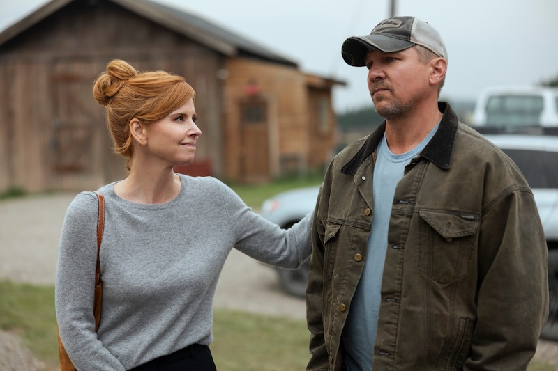 Sarah Rafferty as Katherine and Marc Blucas as George in a rural outdoor environment in ‘My Life with the Walter Boys’ Season 2