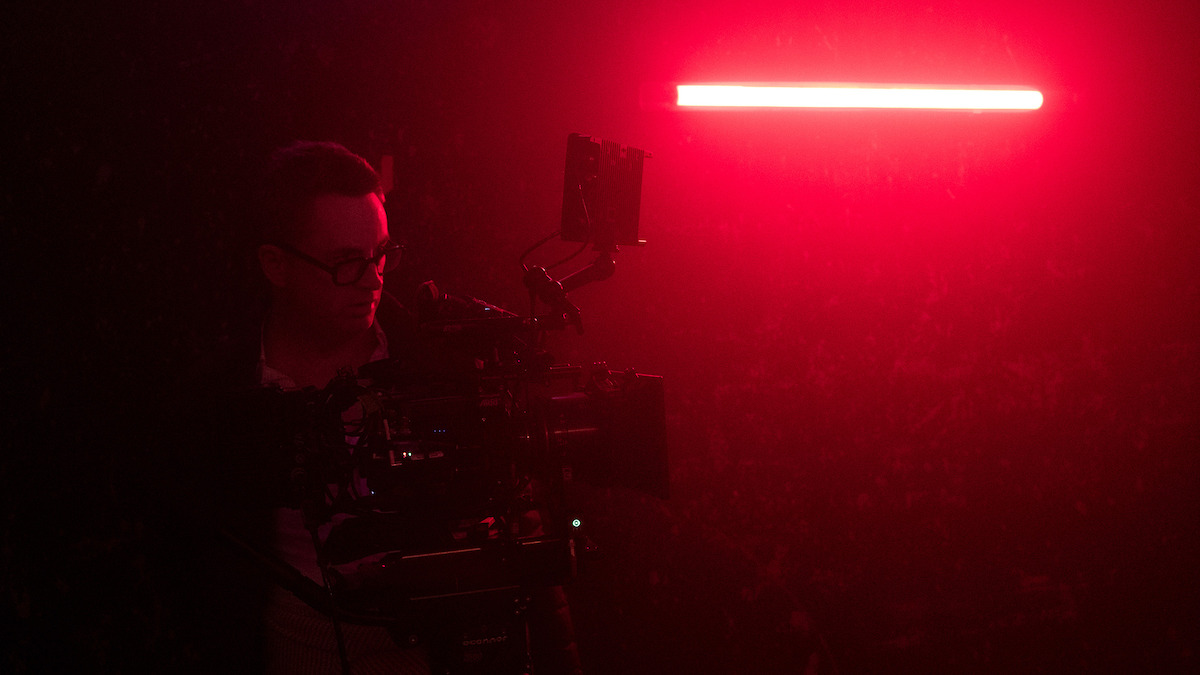 Nicolas Winding Refn works the camera in a red-lit room.