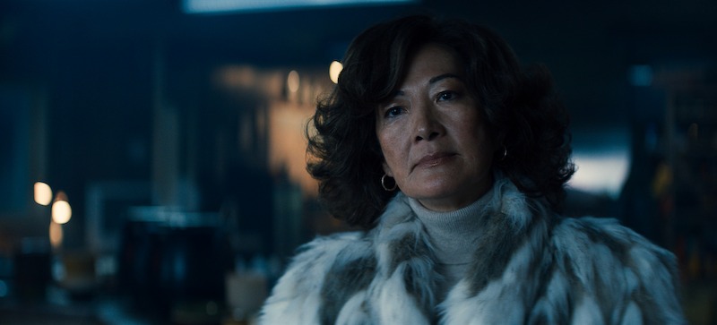 Rosalind Chao as Zhang wears a white fur coat in Season 3 of 'Sweet Tooth'