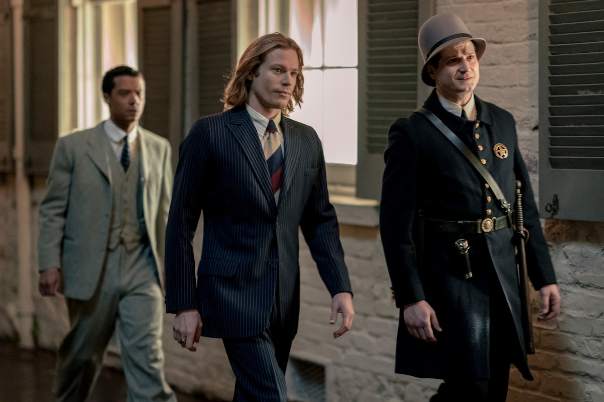 Sam Reid as Lestat De Lioncourt, Bryan Fenkart as Deputy Haversham and Jacob Anderson as Louis De Point Du Lac walk down a street togegther in Season 1 of ‘Interview with the Vampire’