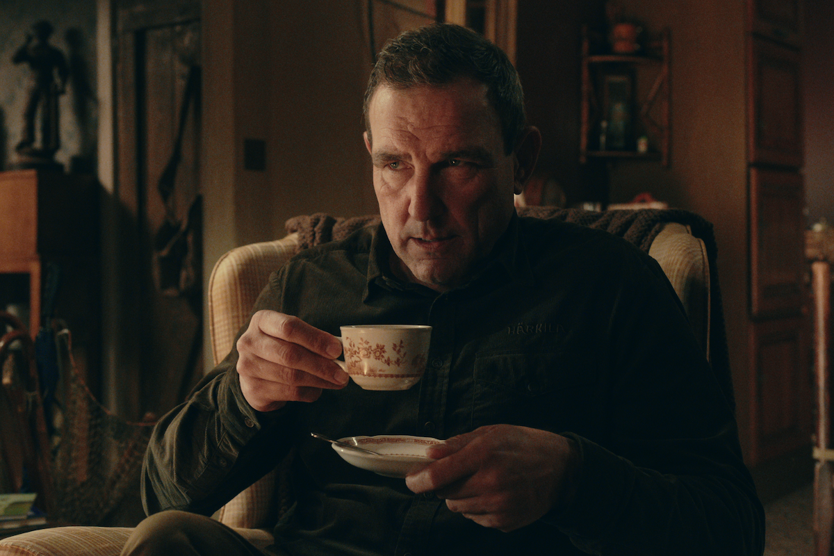 Vinnie Jones as Geoff Seacombe drinks a cup of tea in Season 1 of ‘The Gentlemen’