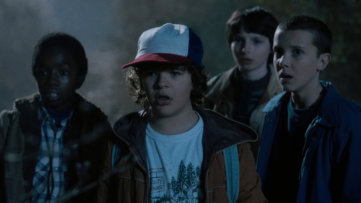 Caleb McLaughlin as Lucas, Gaten Matarazzo as Dustin, Finn Wolfhard as Mike and Millie Bobby Brown as Eleven in ‘Stranger Things 1’