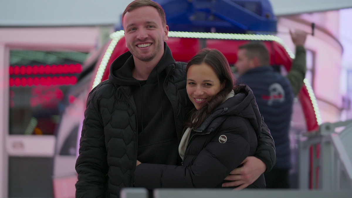 Alina and Ilias share a hug.