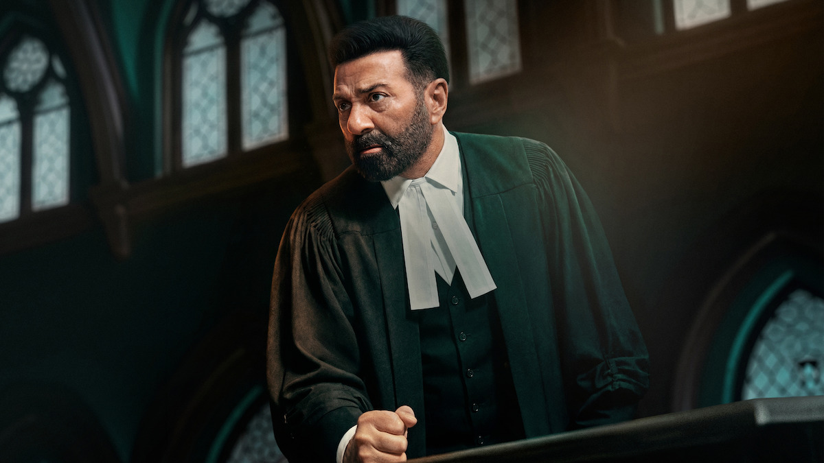 A serious lawyer in traditional black robes stands at a courtroom podium, making a passionate argument. Stained glass windows and gothic architecture create a dramatic, formal legal setting in the background.