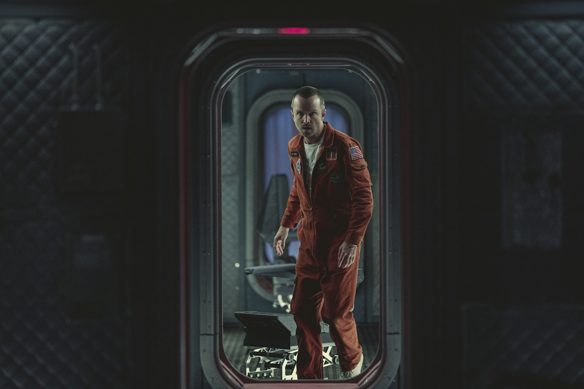 Aaron Paul as Cliff Stanfield in Black Mirror Season 6 standing in doorway.