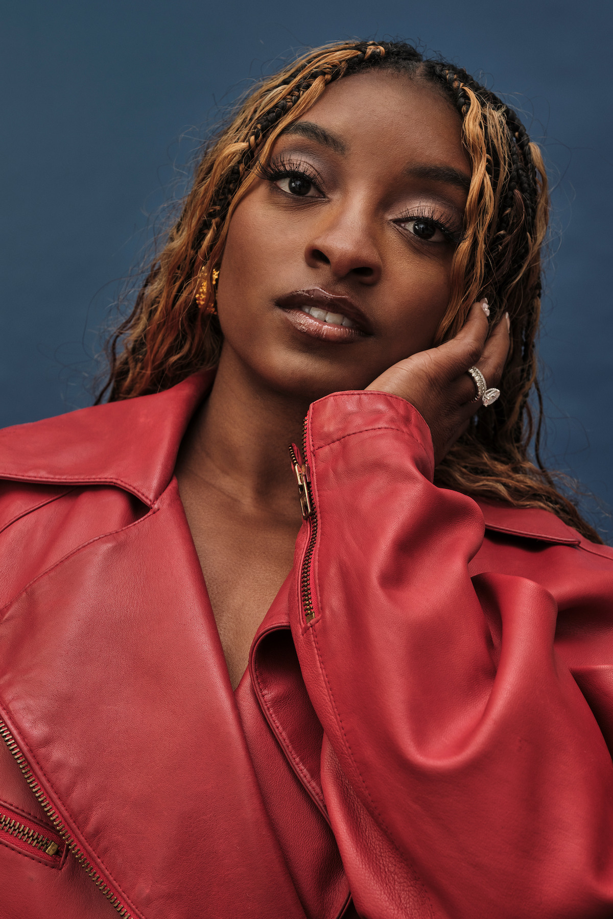 Simone Biles in red leather jacket
