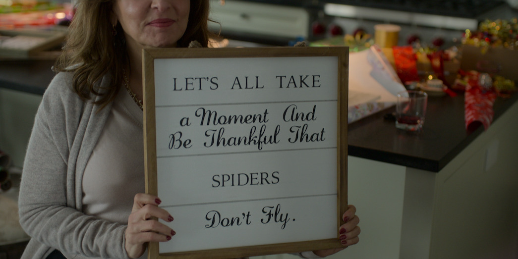 Single All the Way sign reading "Let’s all take a moment and be thankful that spiders don’t fly.”
