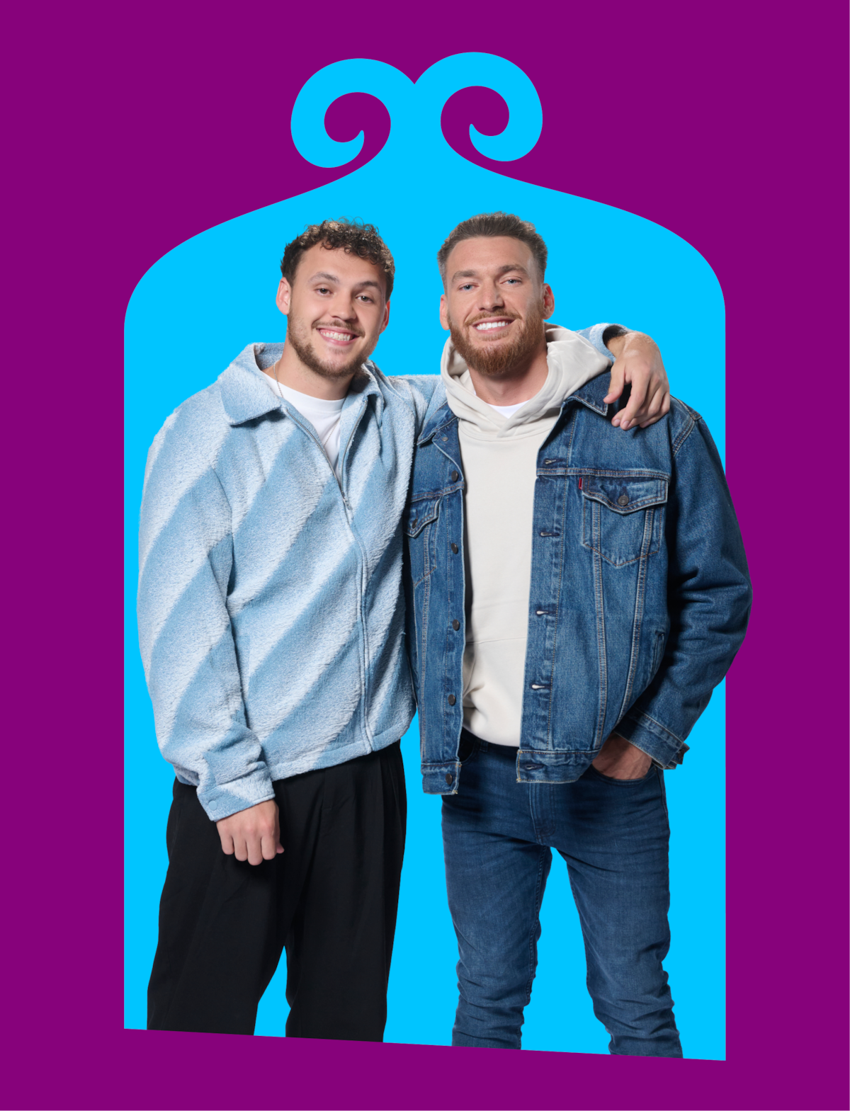 Two men standing side by side smiling, one with an arm around the other's shoulder, in casual clothing against a bright blue background with a purple decorative frame.