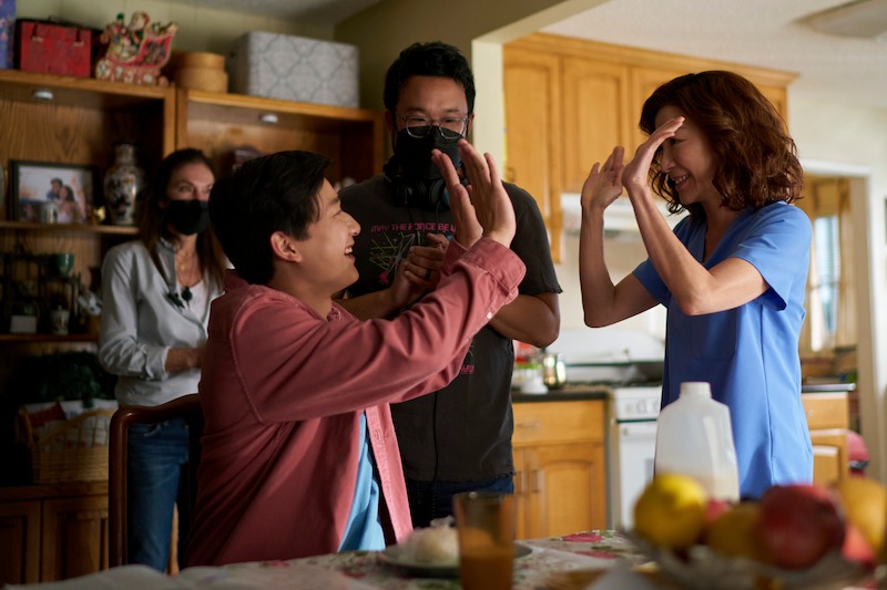 Sam Song Li as Bruce Sun, Director/Executive Producer Kevin Tancharoen, Michelle Yeoh as Mama Sun in episode 101 of The Brothers Sun. 