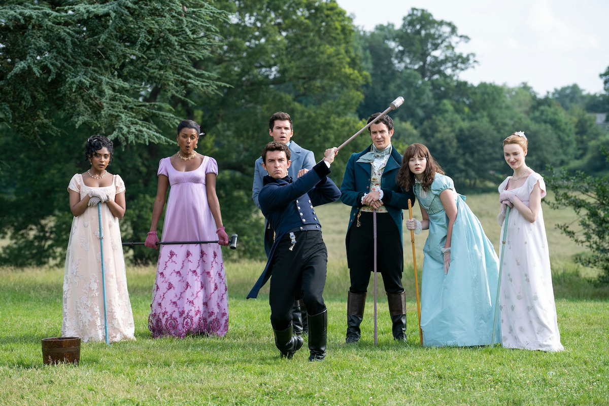 Charithra Chandran as Edwina Sharma, Simone Ashley as Kate Sharma, Luke Newton as Colin Bridgerton, Luke Thompson as Benedict Bridgerton, Jonathan Bailey as Anthony Bridgerton, Claudia Jessie as Eloise Bridgerton, Phoebe Dyvenor as Daphne Basset in episode 203 of Bridgerton.