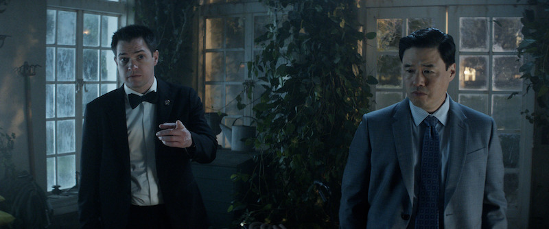 Dan Perrault as Colin Trask, Randall Park as Edwin Park in episode 102 of 'The Residence'.