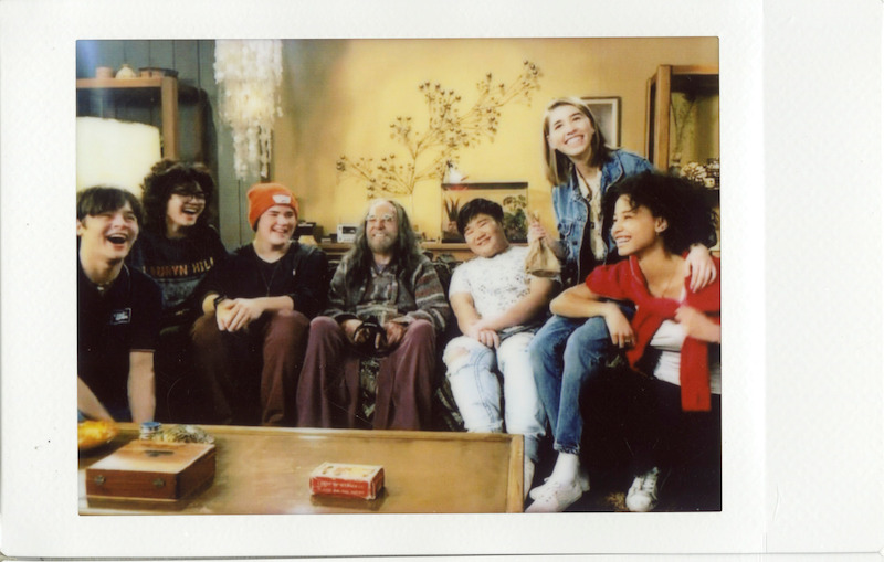 The teens hang with Chong on set.