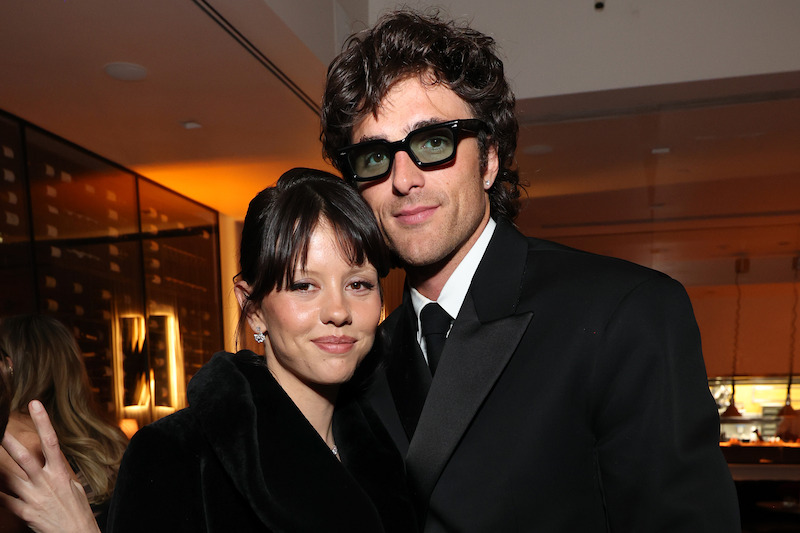 Mia Goth and Jacob Elordi pose for a photo.