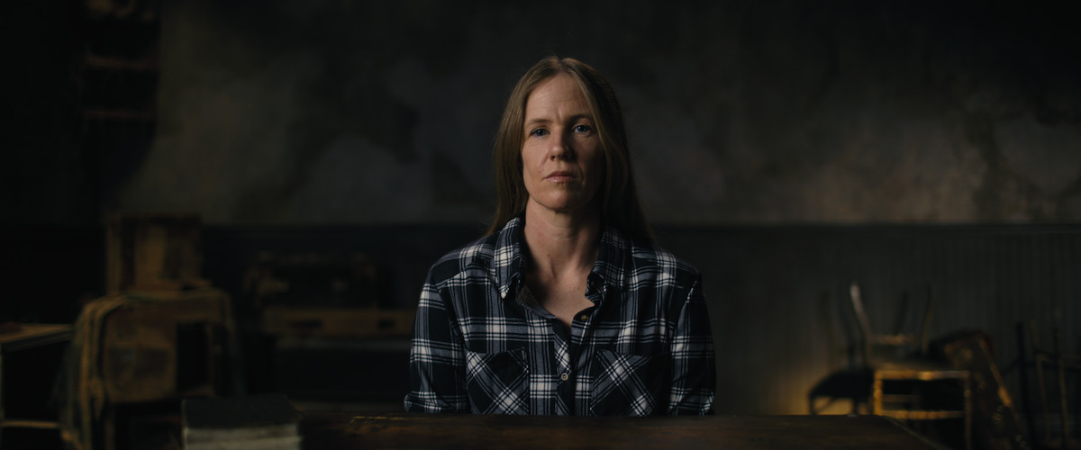 Woman in plaid shirt.