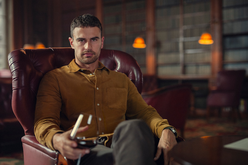 Theo James as Eddie Horniman sits in an office holding a glass of wine in Season 1 of ‘The Gentlemen.’