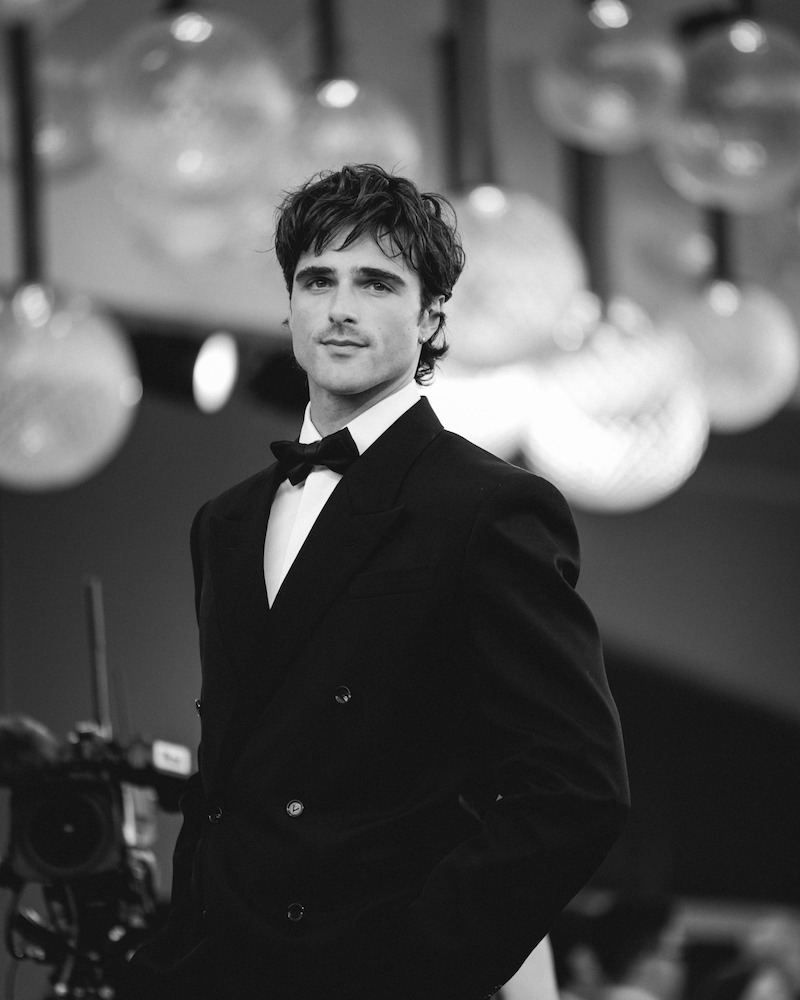 Jacob Elordi poses in a bow tie and jacket on the red carpet.
