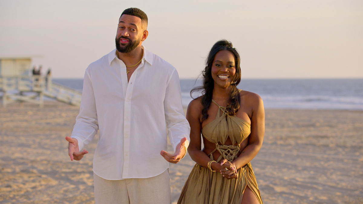 Ollie and AD standing together on the beach.