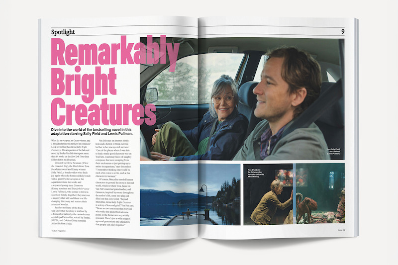 Magazine spread featuring an article titled "Remarkably Bright Creatures" with large pink text, two people smiling in a car, and smaller photos depicting waterfront scenery and indoor settings.