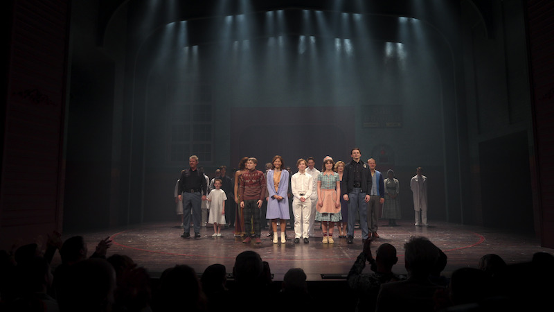 The cast of 'Behind the Curtain: Stranger Things: The First Shadow' stands on stage.