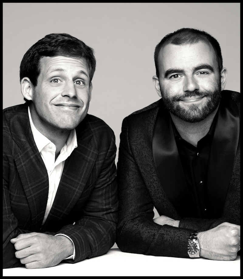 Tanner Smith and Connor Tomlinson take a photo together smiling.