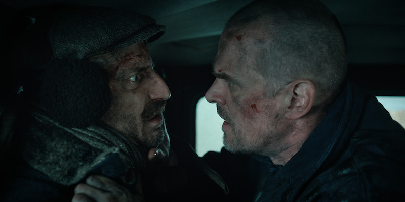 From left: Djuricko as Yuri and Harbour as Hopper in Stranger Things Season 4, Volume 2 - See Over 100 Photos From ‘Stranger Things’ Season 4 Volume 2