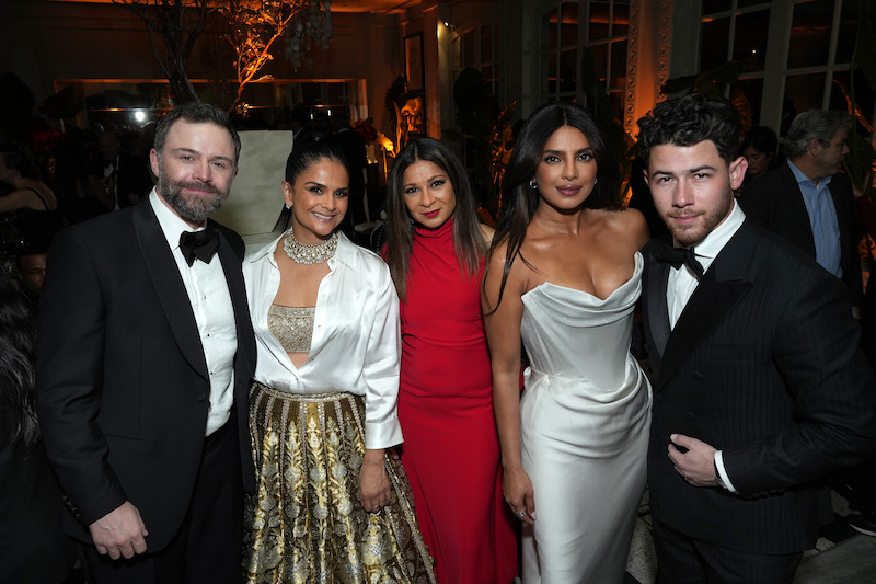 Philip Barantini, Bela Bajaria, a guest, Priyanka Chopra, and Nick Jonas pose for the camera.