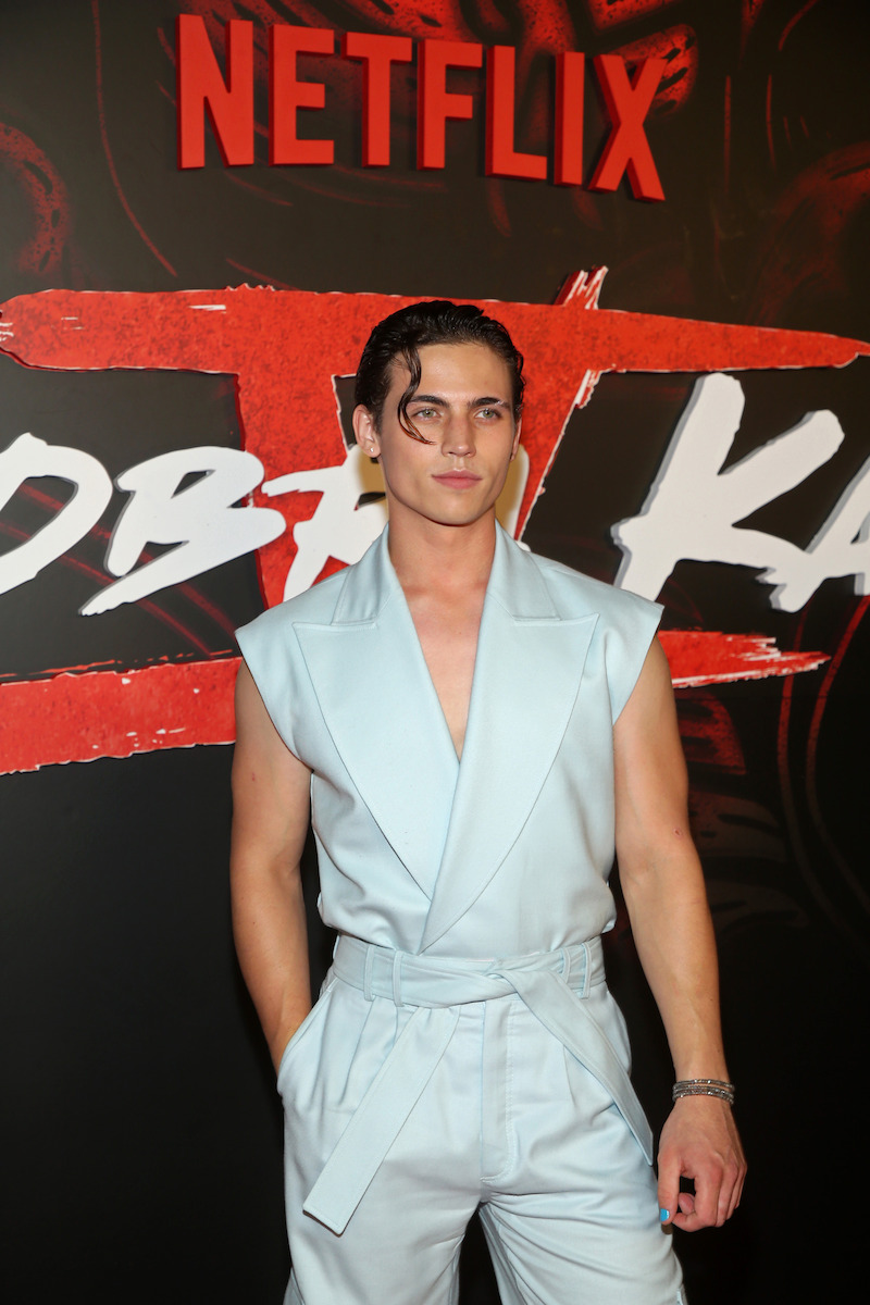 Karate gi, but make it fashion — and Tanner Buchanan (Robby) pulls it off.