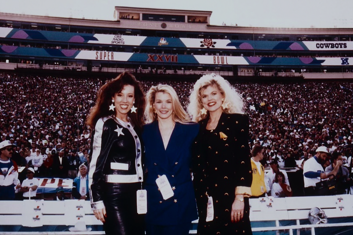 Kelli Finglass, Judy Trammell, and Tina Kalina pose for a photo at Super Bowl XXVII.
