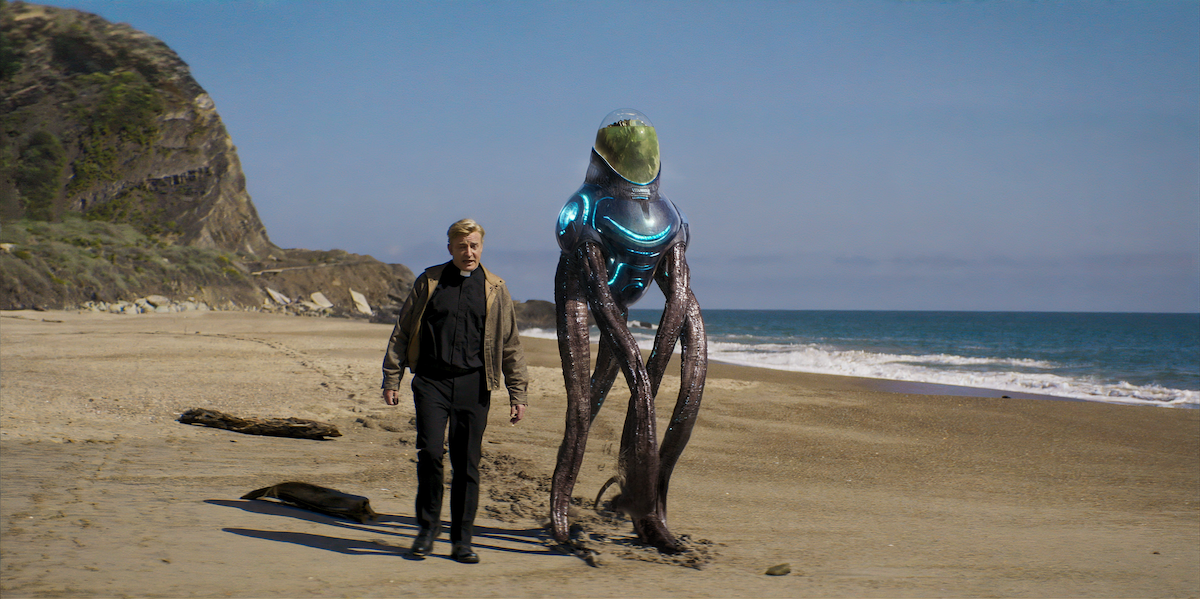 Animated still of a priest walking on the beach with an alien in the episode “Golgotha” from ‘Love, Death + Robots’ Volume 4