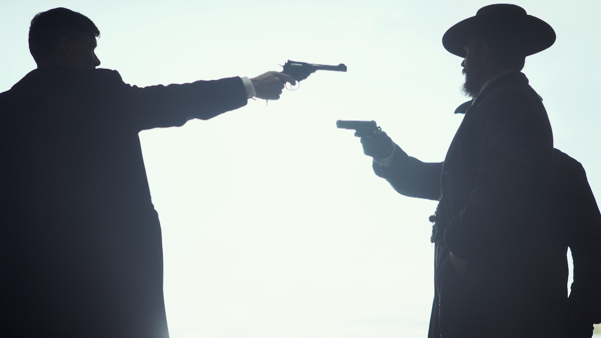 A gun heist between two men in Season 3 of 'Peaky Blinders'.