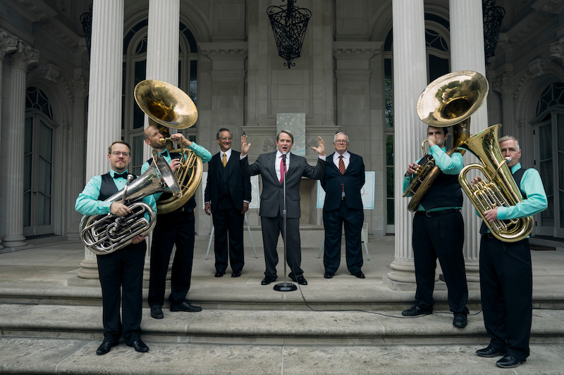 A band plays in front of a building