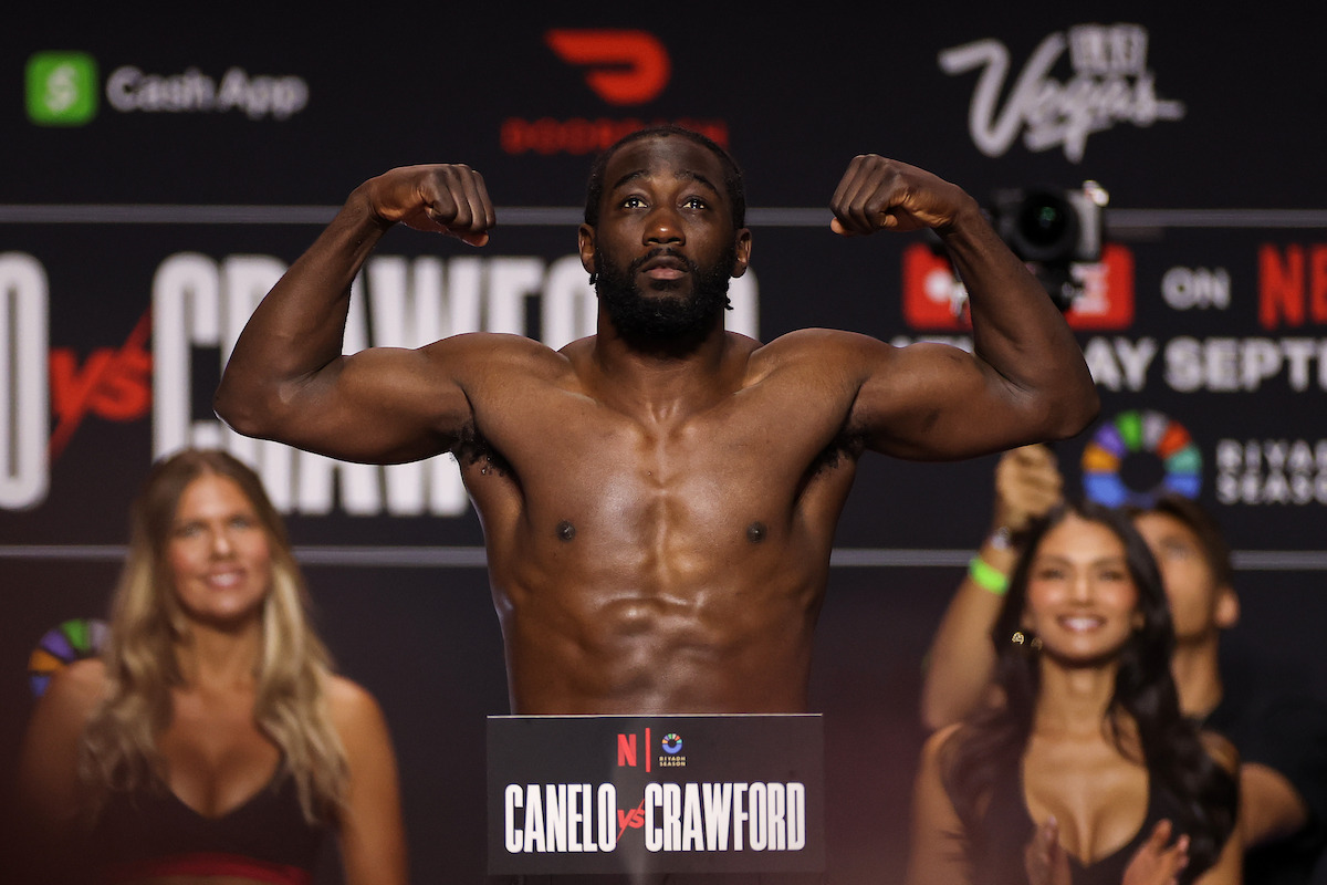 Terence Crawford poses on the scale during a weigh-in ahead of his undisputed super middleweight title fight at T-Mobile Arena.