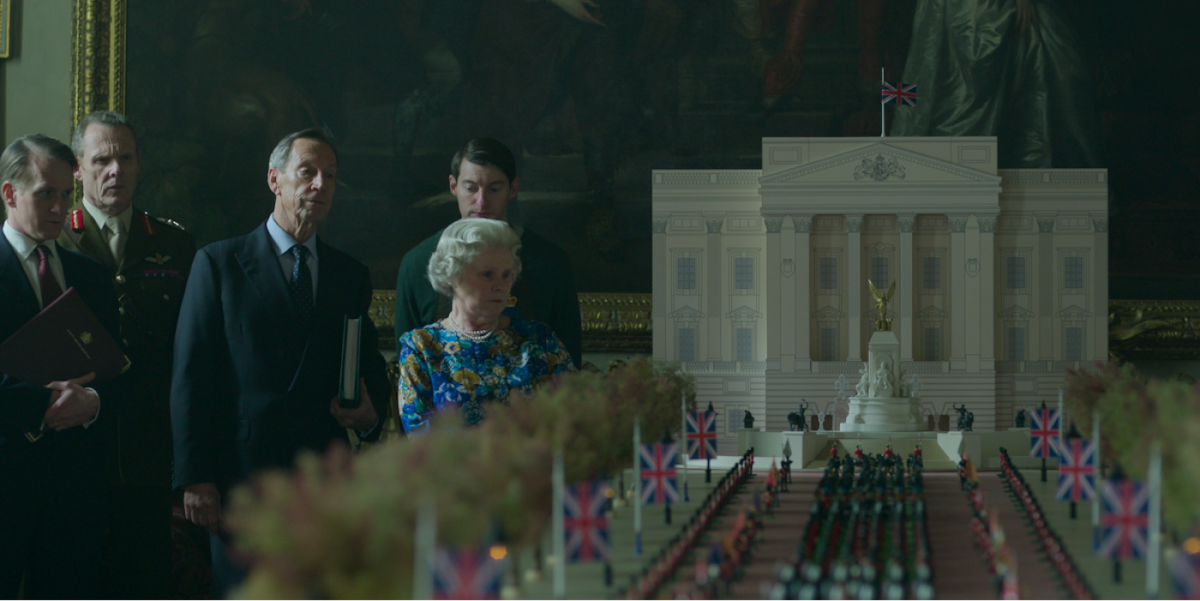 Imelda Staunton as Queen Elizabeth looks a a miniature model of a funeral procession in Season 6 Part 2 of ‘The Crown’