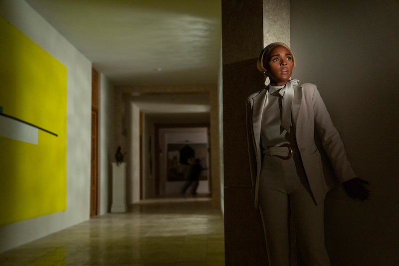 Janelle Monáe hides in the shadows.