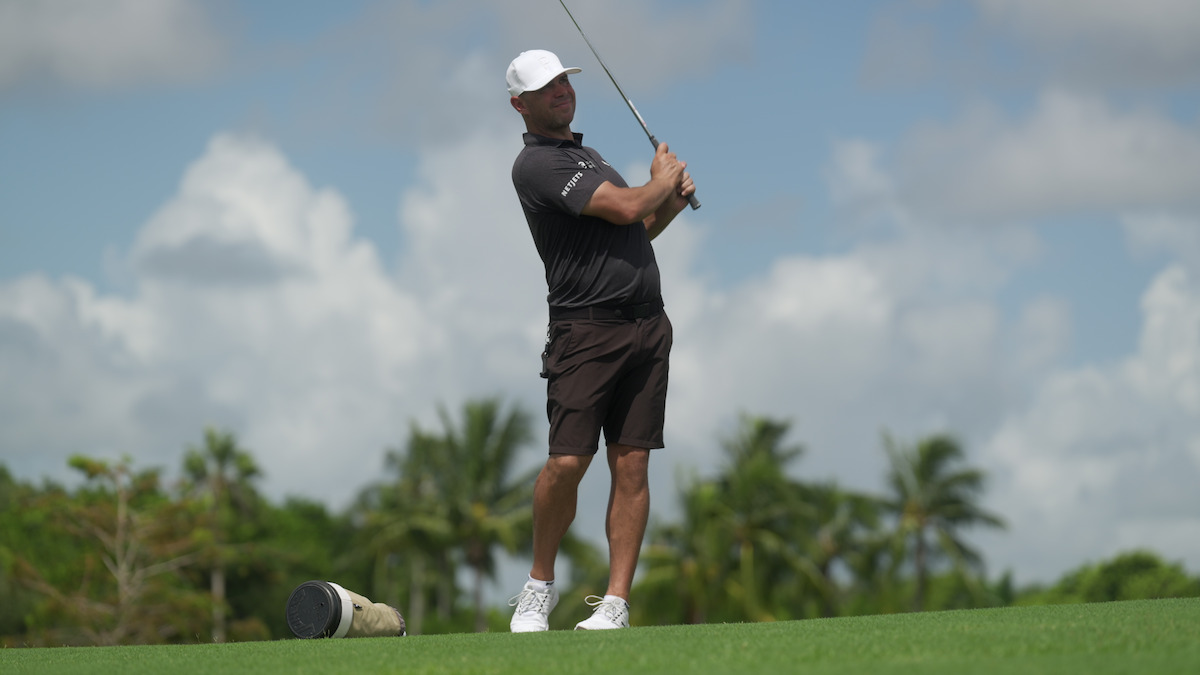 Gary Woodland takes a swing with his golf club.