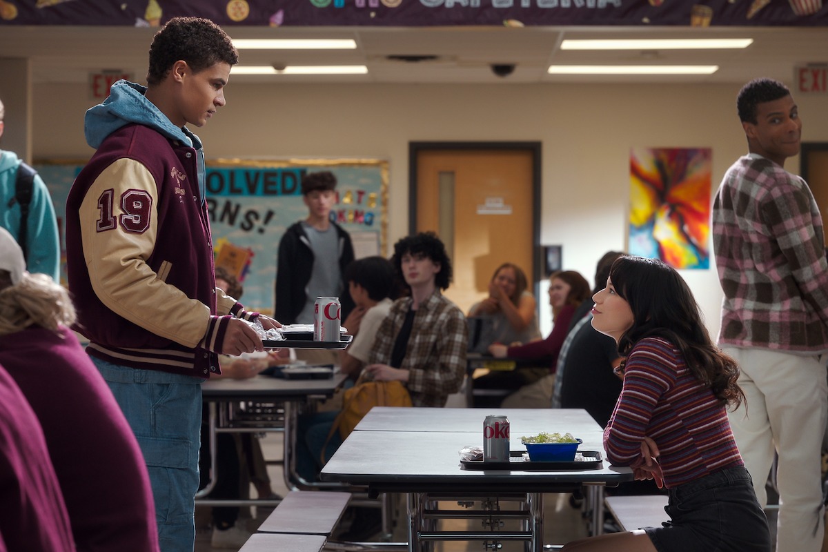Kolton Stewart as Dylan and Mya Lowe as Kiley in a school cafeteria ‘My Life with the Walter Boys’ Season 2.