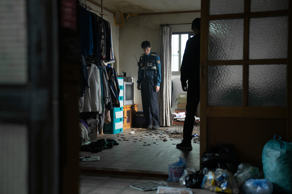 Kim Nam-gil as Lee Do stands in a disheveled room in an image from the series ‘Trigger.’