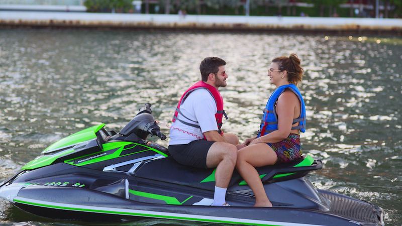 two people facing each other on a jetski